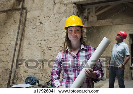 Construction worker carrying blueprints View Large Photo Image Stock Image - Construction worker carrying blueprints. Fotosearch