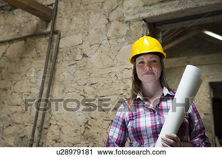 Construction worker carrying blueprints View Large Photo Image Stock Image - Construction worker carrying blueprints. Fotosearch