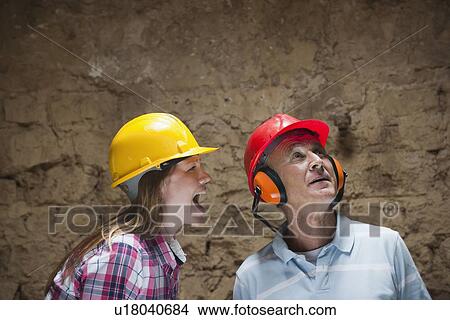 Construction worker yelling at colleague View Large Photo Image Picture - Construction worker yelling at colleague. Fotosearch