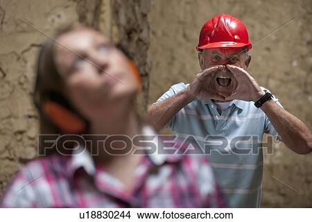 Construction worker yelling at colleague View Large Photo Image Picture - Construction worker yelling at colleague. Fotosearch