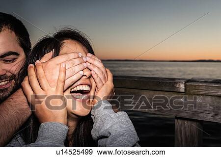 Stock Photo - Couple playing together outdoors. Fotosearch