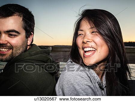 Couple smiling together outdoors View Large Photo Image Stock Photo - Couple smiling together outdoors. Fotosearch