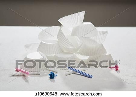 Stock Photo - Cupcake wrappers and birthday candles. Fotosearch