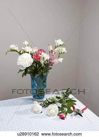 Cut flowers with bouquet in vase View Large Photo Image Stock Image - Cut flowers with bouquet in vase. Fotosearch