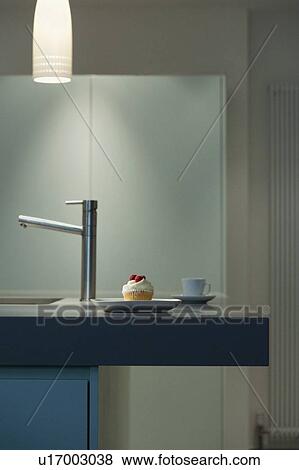 Decorated cupcake on modern counter View Large Photo Image Stock Photo - Decorated cupcake on modern counter. Fotosearch