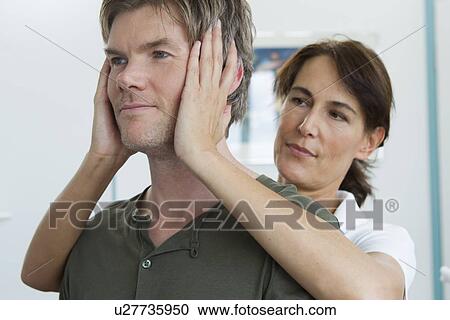Doctor examining patient in office View Large Photo Image Stock Image - Doctor examining patient in office. Fotosearch