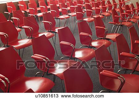Empty red chairs in room View Large Photo Image Stock Image - Empty red chairs in room. Fotosearch