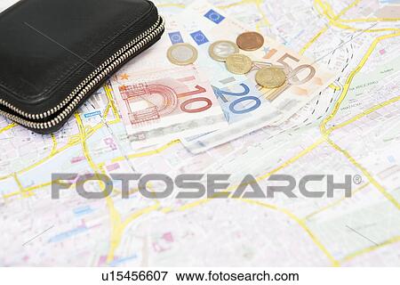 Euro notes and coins on city map View Large Photo Image Stock Photo - Euro notes and coins on city map. Fotosearch