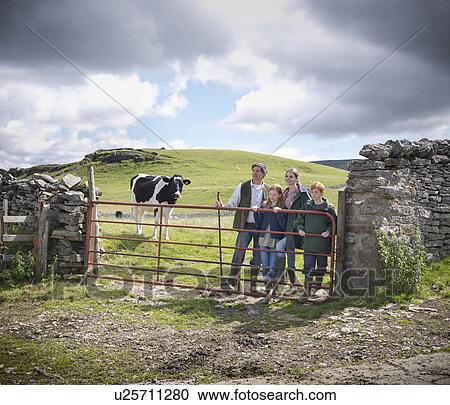Farmer and family standing in field View Large Photo Image Stock Image - Farmer and family standing in field. Fotosearch