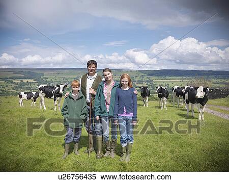 Farmer posing with family in field View Large Photo Image Stock Photography - Farmer posing with family in field. Fotosearch