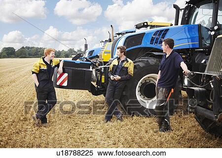 Farmers talking by machinery in field View Large Photo Image Stock Photography - Farmers talking by machinery in field. Fotosearch