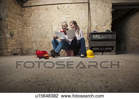 Father and daughter examining papers View Large Photo Image Stock Image - Father and daughter examining papers. Fotosearch