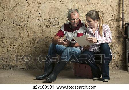 Father and daughter examining papers View Large Photo Image Stock Image - Father and daughter examining papers. Fotosearch