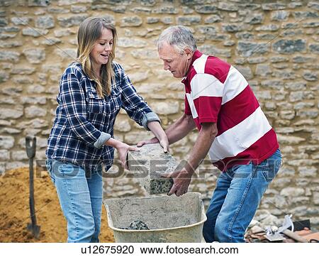 Father and daughter working together View Large Photo Image Stock Image - Father and daughter working together. Fotosearch