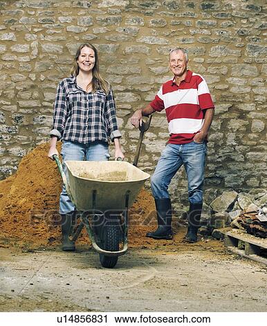 Stock Image - Father and daughter working together. Fotosearch