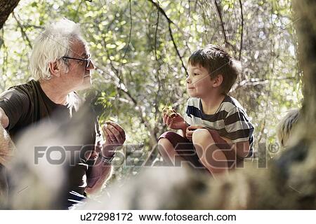 Father and his sons playing in the forest View Large Photo Image Stock Image - Father and his sons playing in the forest. Fotosearch