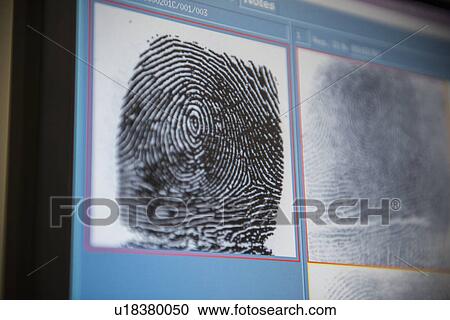 Stock Image - Fingerprints on screen in forensic lab. Fotosearch