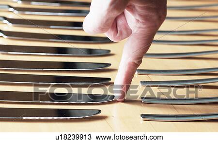 Fingertip touching point of butter knife View Large Photo Image Stock Image - Fingertip touching point of butter knife. Fotosearch