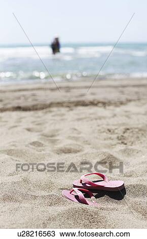 Flip flops on sandy beach View Large Photo Image Stock Image - Flip flops on sandy beach. Fotosearch