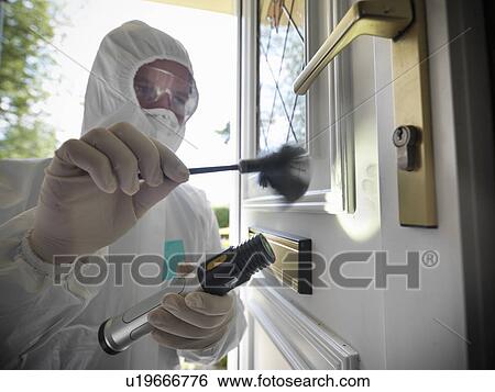 Stock Photograph - Forensic scientist dusting door. Fotosearch