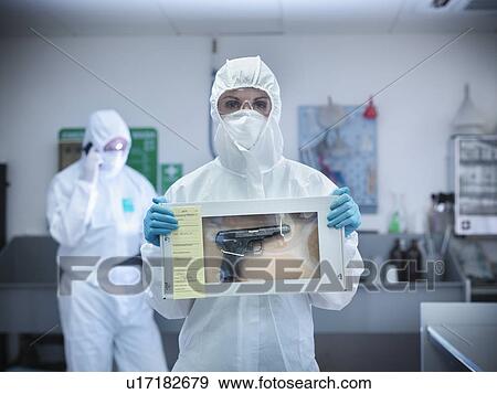 Stock Photo - Forensic scientist with gun in box. Fotosearch