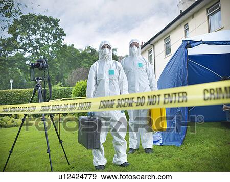 Stock Photo - Forensic scientists at crime scene. Fotosearch