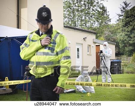 Stock Photo - Forensic scientists at crime scene. Fotosearch