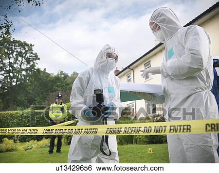 Forensic scientists at crime scene View Large Photo Image Stock Photograph - Forensic scientists at crime scene. Fotosearch