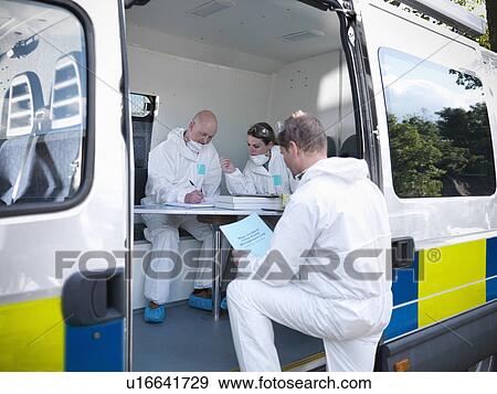 Forensic scientists in police truck View Large Photo Image Stock Photo - Forensic scientists in police truck. Fotosearch
