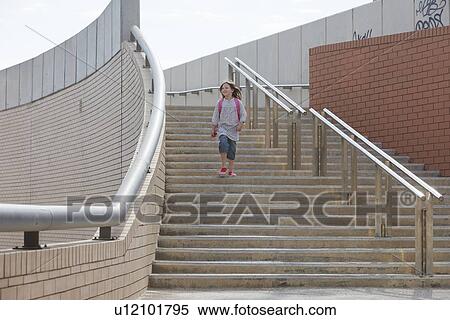 Girl climbing stairs outdoors View Large Photo Image Stock Photography - Girl climbing stairs outdoors. Fotosearch