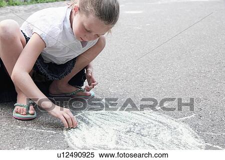 Girl drawing sun on sidewalk in chalk View Large Photo Image Stock Photography - Girl drawing sun on sidewalk in chalk. Fotosearch