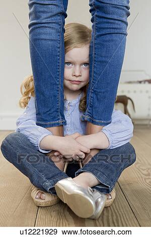 Girl hugging mothers ankles View Large Photo Image Stock Photo - Girl hugging mothers ankles. Fotosearch