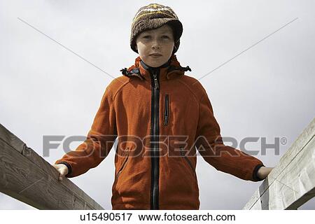 Girl standing on wooden walkway View Large Photo Image Stock Photo - Girl standing on wooden walkway. Fotosearch