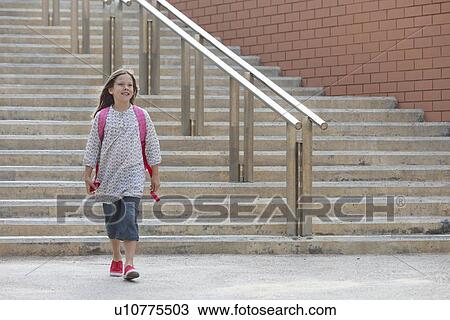 Girl walking by steps outdoors View Large Photo Image Stock Image - Girl walking by steps outdoors. Fotosearch