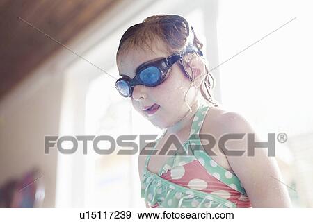 Girl wearing goggles by pool View Large Photo Image Stock Photo - Girl wearing goggles by pool. Fotosearch