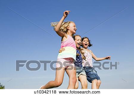 Girls playing together outdoors View Large Photo Image Stock Photo - Girls playing together outdoors. Fotosearch