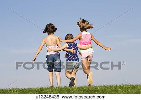 Girls playing together outdoors View Large Photo Image Stock Photograph - Girls playing together outdoors. Fotosearch