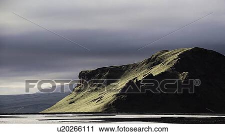 Grassy hills in rural landscape View Large Photo Image Stock Image - Grassy hills in rural landscape. Fotosearch