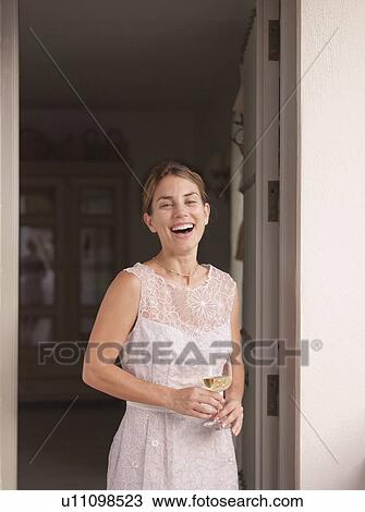 Laughing woman with glass of wine View Large Photo Image Stock Image - Laughing woman with glass of wine. Fotosearch