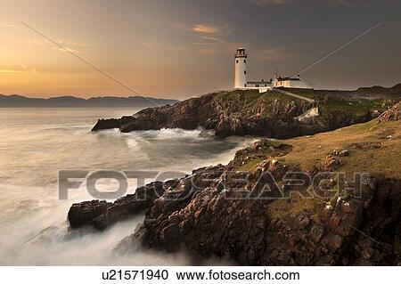 Lighthouse on foggy coastline View Large Photo Image Stock Image - Lighthouse on foggy coastline. Fotosearch