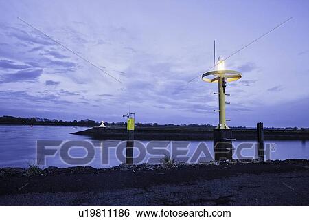 Stock Photograph - Lights on river lit up at night. Fotosearch