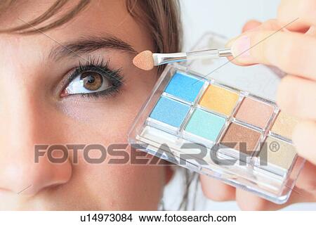 Picture - Make up artist applying eyeshadow. Fotosearch