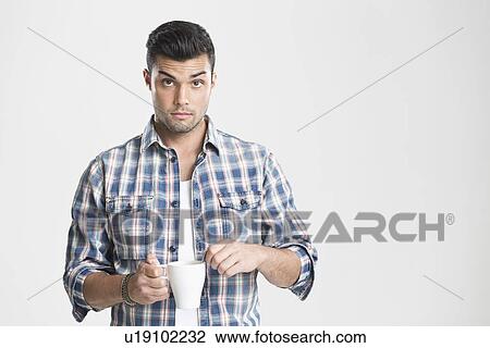 Man having cup of coffee View Large Photo Image Stock Image - Man having cup of coffee. Fotosearch
