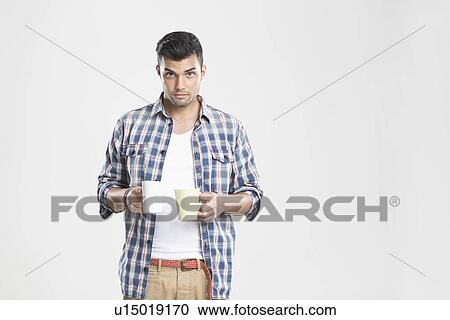 Man holding cups of coffee View Large Photo Image Stock Image - Man holding cups of coffee. Fotosearch