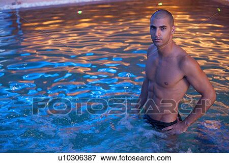 Man relaxing in indoor jacuzzi View Large Photo Image Stock Photo - Man relaxing in indoor jacuzzi. Fotosearch