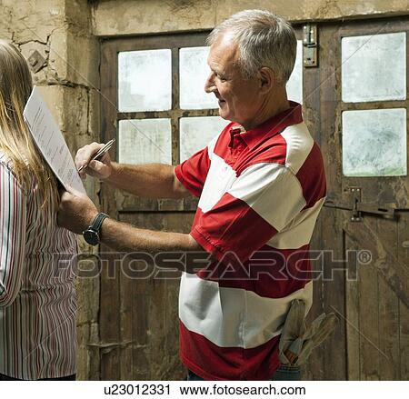 Man signing papers on womans back View Large Photo Image Stock Image - Man signing papers on womans back. Fotosearch