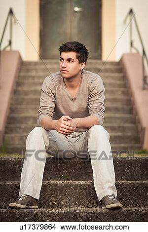 Man sitting on front steps View Large Photo Image Picture - Man sitting on front steps. Fotosearch