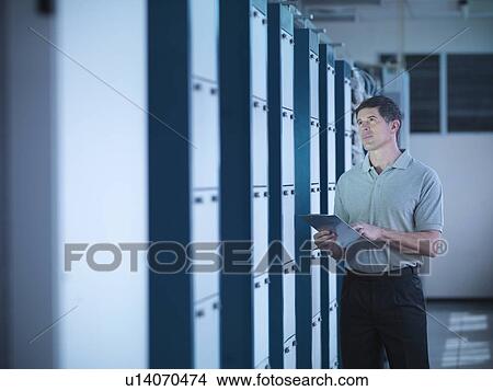 Picture - Man working in telephone exchange. Fotosearch