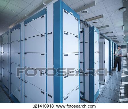 Man working in telephone exchange View Large Photo Image Stock Photo - Man working in telephone exchange. Fotosearch