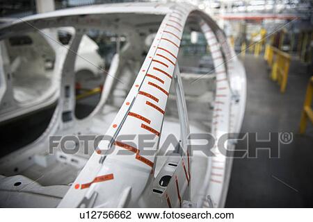 Stock Image - Master car body on production line in car factory. Fotosearch